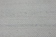 A close-up of a woven fabric texture in a light off-white or cream color with subtle gray marled threads.
