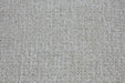 A close-up texture shot of a loop pile carpet in a warm off-white or cream color.
