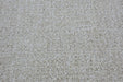 A close-up texture shot of a loop pile carpet in a warm off-white or cream color.