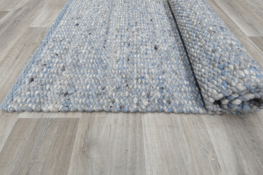 harmonious blend of soft blues, grays, and whites with subtle hints of black- Rugs Direct 