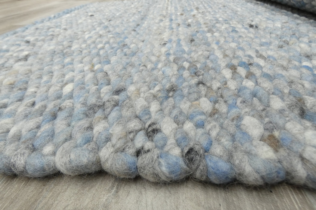 harmonious blend of soft blues, grays, and whites with subtle hints of black- Rugs Direct 