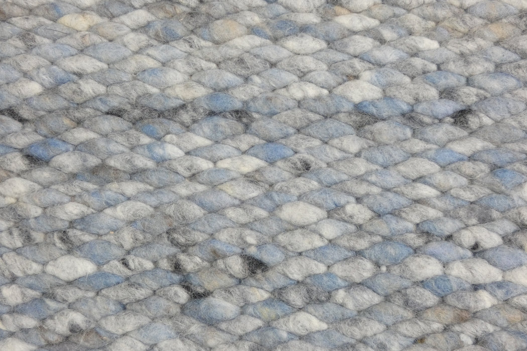 harmonious blend of soft blues, grays, and whites with subtle hints of black- Rugs Direct 