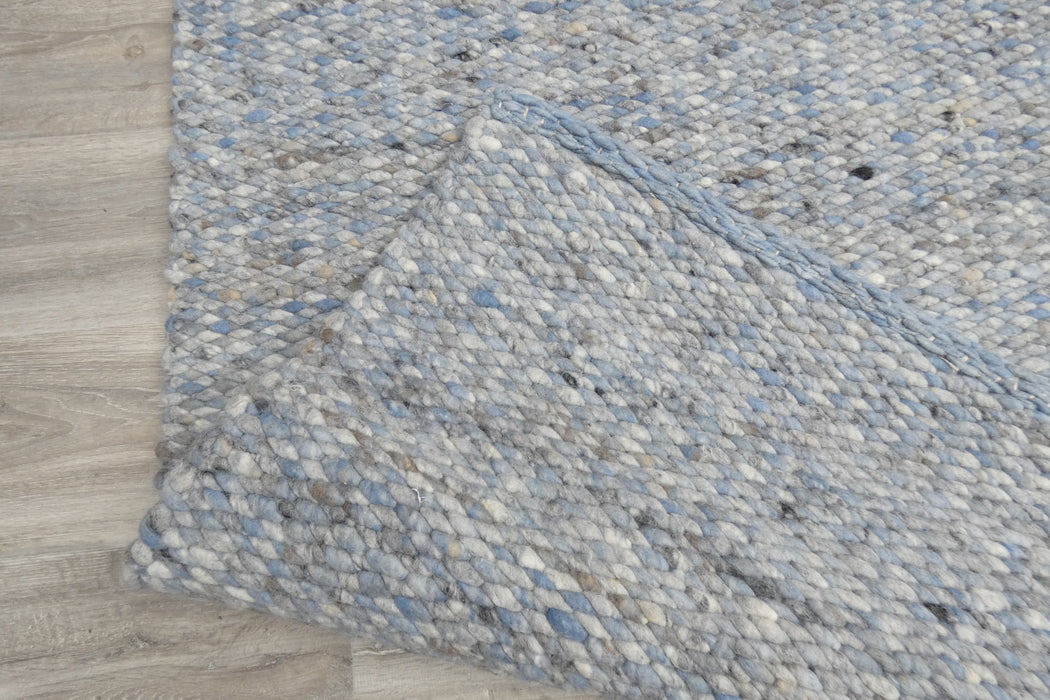 harmonious blend of soft blues, grays, and whites with subtle hints of black- Rugs Direct 