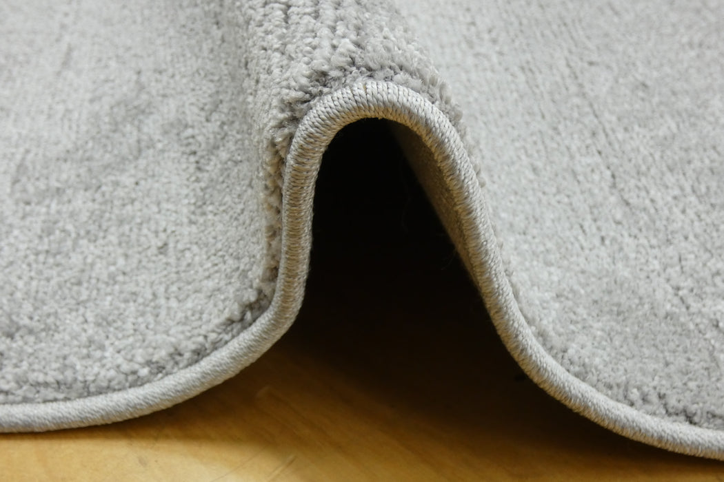 Luxurious Plain Textured Trentino Pebble Shape Rug (41005-2121) Size: 200 x 290cm - Rugs Direct