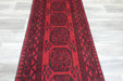 Red Afghan Turkman Bokhara hand-knotted wool rug featuring traditional repeating Gul medallions, 100 × 200 cm.Rugs Direct NZ