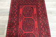 Red Afghan Turkman Bokhara hand-knotted wool rug featuring traditional repeating Gul medallions, 100 × 200 cm.Rugs Direct NZ