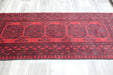 Red Afghan Turkman Bokhara hand-knotted wool rug featuring traditional repeating Gul medallions, 100 × 200 cm.Rugs Direct NZ