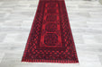 Red Afghan Turkman Bokhara hand-knotted wool rug featuring traditional repeating Gul medallions, 100 × 200 cm.Rugs Direct NZ