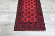 Red Afghan Turkman Bokhara hand-knotted wool rug featuring traditional repeating Gul medallions, .Rugs Direct NZ