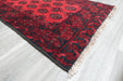Red Afghan Turkman Bokhara hand-knotted wool rug featuring traditional repeating Gul medallions, .Rugs Direct NZ
