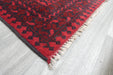 Red Afghan Turkman Bokhara hand-knotted wool rug featuring traditional repeating Gul medallions, 100 × 200 cm.Rugs Direct NZ