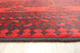 Red Afghan Turkman Bokhara hand-knotted wool rug featuring traditional repeating Gul medallions, 100 × 200 cm.Rugs Direct NZ