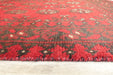 Red Afghan Turkman Bokhara hand-knotted wool hallway runner featuring repeating oval Gul medallions and traditional geometric borders.Rugs Direct NZ