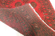 Red Afghan Turkman Bokhara hand-knotted wool hallway runner featuring repeating oval Gul medallions and traditional geometric borders.Rugs Direct NZ