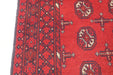 Red Afghan Turkman Bokhara hand-knotted wool hallway runner featuring repeating oval Gul medallions and traditional geometric borders. Rugs Direct NZ
