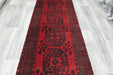 Red Afghan Turkman Bokhara hand-knotted wool hallway runner featuring repeating oval Gul medallions and traditional geometric borders.Rugs Direct NZ