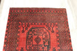 Red Afghan Turkman Bokhara hand-knotted wool hallway runner featuring repeating oval Gul medallions and traditional geometric borders.Rugs Direct NZ