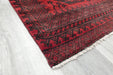 Red Afghan Turkman Bokhara hand-knotted wool hallway runner featuring repeating oval Gul medallions and traditional geometric borders.Rugs Direct NZ