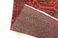 Red Afghan Turkman Bokhara hand-knotted wool hallway runner featuring repeating oval Gul medallions and traditional geometric borders.Rugs Direct NZ