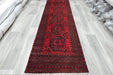 Red Afghan Turkman Bokhara hand-knotted wool hallway runner featuring repeating oval Gul medallions and traditional geometric borders.Rugs Direct NZ