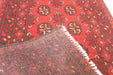 Red Afghan Turkman Bokhara hand-knotted wool hallway runner featuring repeating oval Gul medallions and traditional geometric borders.Rugs Direct NZ