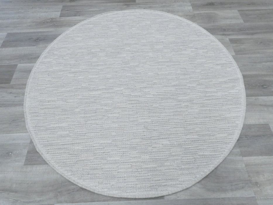 Off white round wool rug 