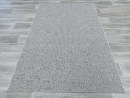 Grey Wool Rug on the floor